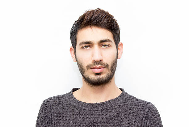 istock Portrait of young man looking at camera with blank expression 507171378