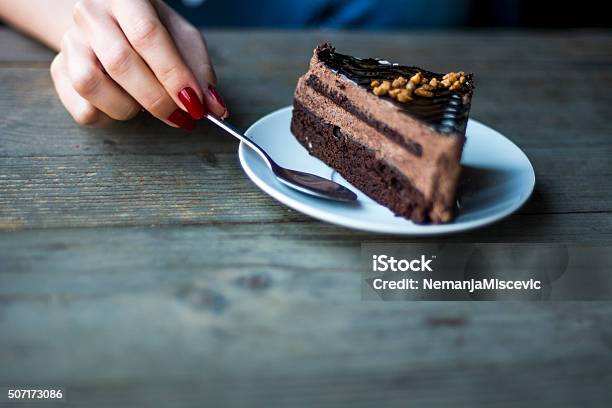 Piece Of Of Chocolate Cake On The Table Stock Photo - Download Image Now - Cake, Women, Adult