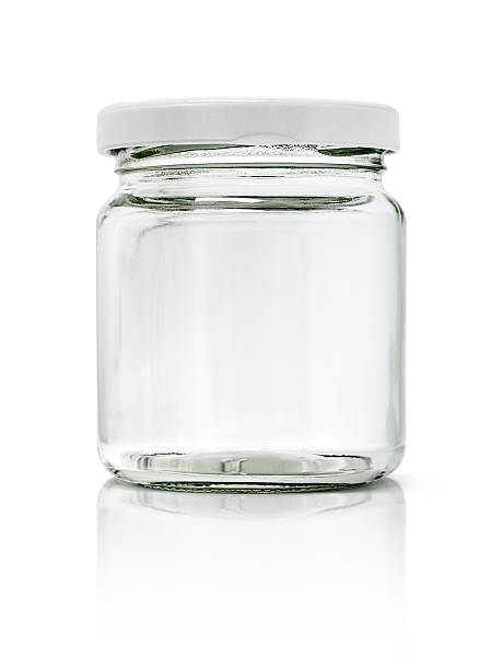 istock Clear glass bottle with white cap isolated on white background 507173910