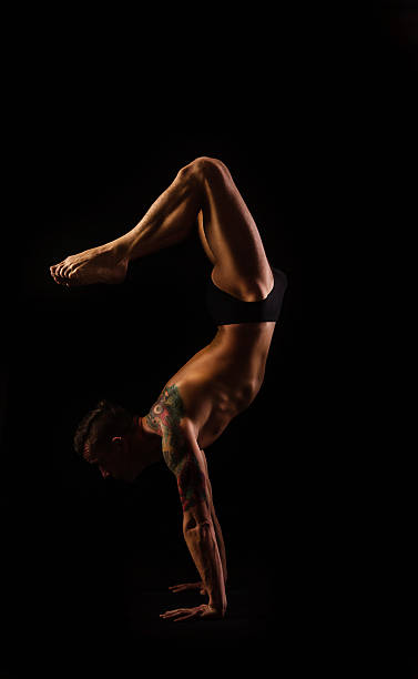 istock young man in yoga and gymnastics, posture scorpion 507174366