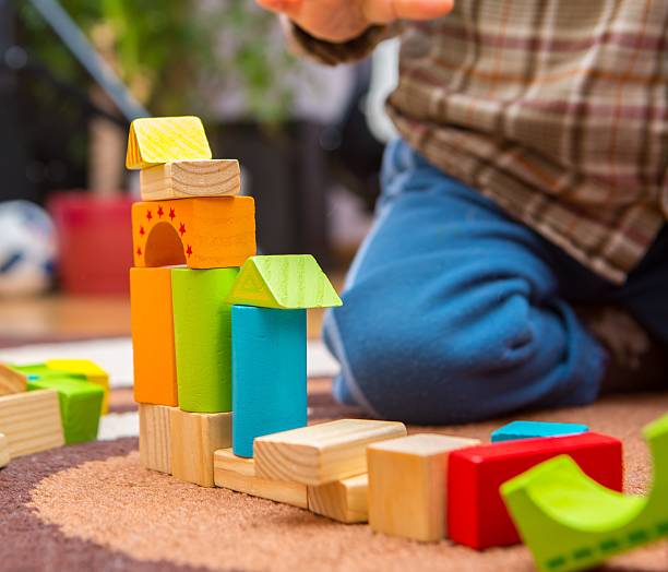 istock Small child playing with wooden blocks 507174638