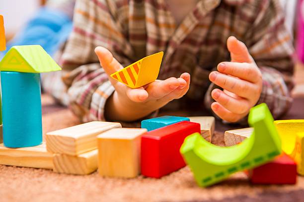istock Small child playing with wooden blocks 507174650