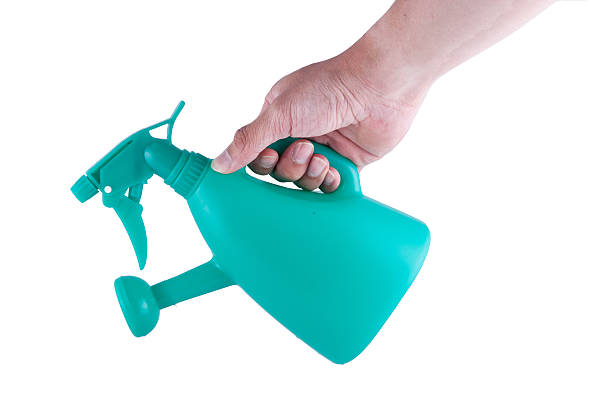 istock hand holding watering can isolated on white background 507175762