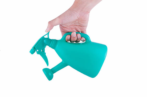 istock hand holding watering can isolated on white background 507175854