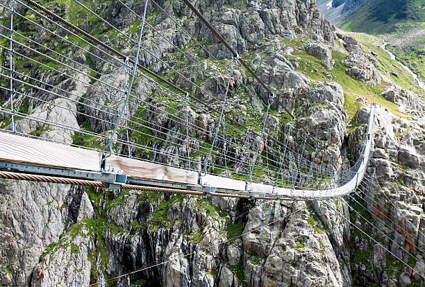 istock Trift Bridge, pedestrian-only suspension bridge in Alps. Svitzerland 507177574