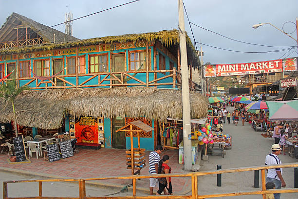 Montañita, Ecuador Market Montañita, Ecuador - November 3, 2014: People walking the colorful streets of the Montanita Mini Market, a popular tourist shopping location at dusk. montanita ecuador stock pictures, royalty-free photos & images