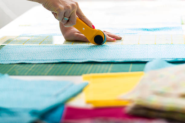 istock Cutting material with rotary blade cutter for quilt 507179892