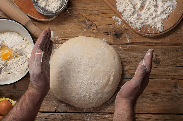 istock Male baker prepares homemade bread 507179946