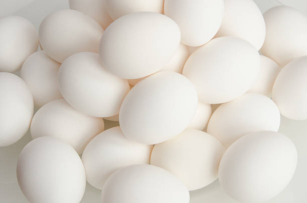 istock Close up of white chicken eggs on a plate 507181286