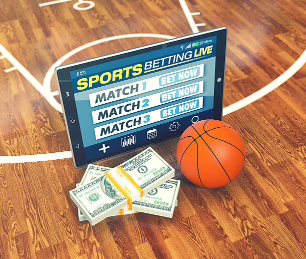 concept of online sport bets tablet pc with app for sport bets, stacks of banknotes and a basketball ball, concept of online bets (3d render) online ice hockey free betting stock pictures, royalty-free photos & images