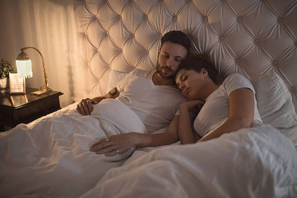istock Young loving couple taking a nap in bed. 507184370
