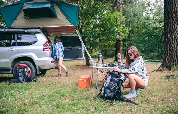 istock Woman preparing backpack for a hiking trip 507185014