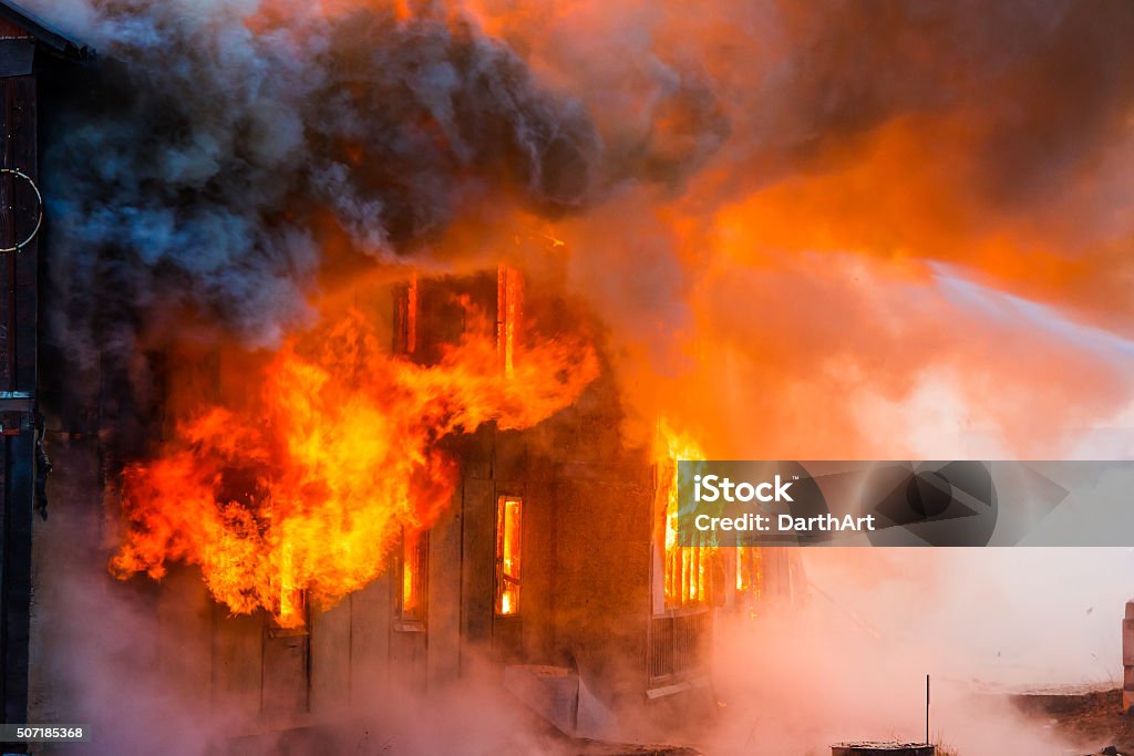 Fire in a house Fire in an old wooden house Fire - Natural Phenomenon Stock Photo