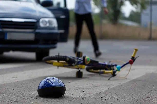 Photo of Car driver hitting little biker