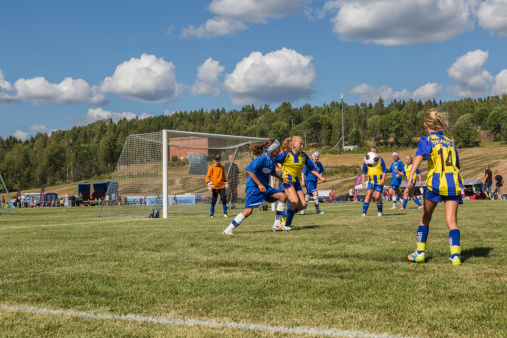 Timraa, Sweden â July 31, 2014: Young girl football teams competing in a public football tournament on public municipality football grounds