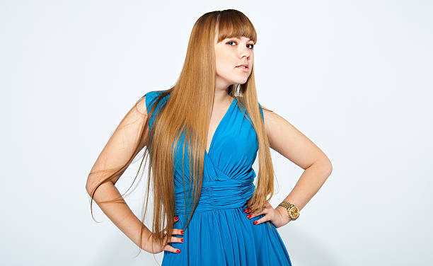 Girl wearing blue dress stock photo