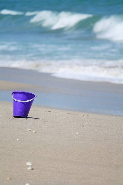 istock Purple Pail at the Beach 507189915