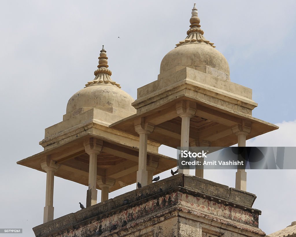 Ancient Dome Resting Birds on Ancient Dome Under the Blue Sky at Jaipur, Rajasthan, India. Amber Fort Stock Photo