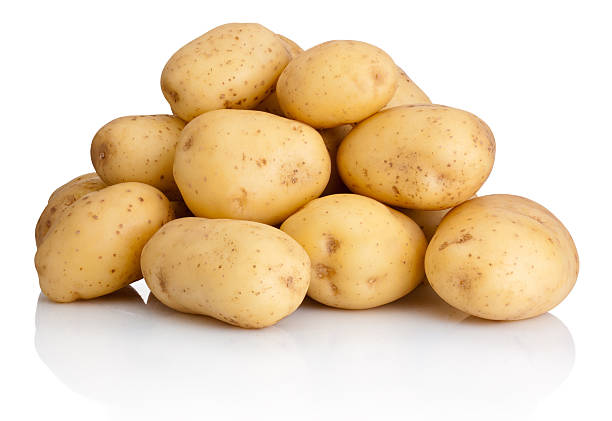 Heap of potatoes isolated on white background
