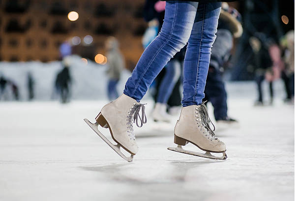 The girl on the figured skates Girl on the figured skates at opened skating rink. Russia. ice skating photos stock pictures, royalty-free photos & images