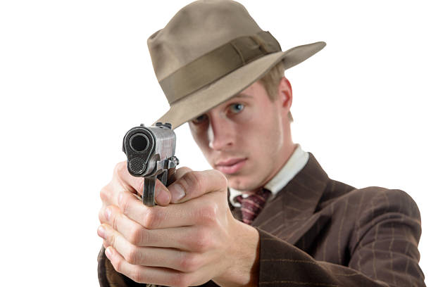 A man holding a gun in hand, the ship ready to shoot the man pointed a gun at us. A man holding a gun was robbed.