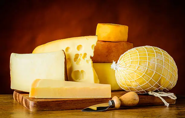 Different types of cheese in still life