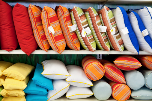 Multicolored cushions on display in store