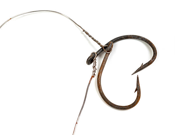 istock Old rusty fish hooks in form of heart 507211390