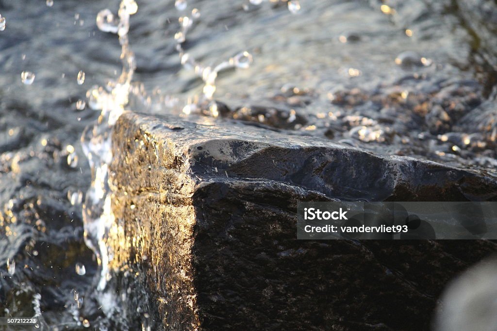 Water Rock Water hitting a rock in Fish Creek, WI. Door County Stock Photo