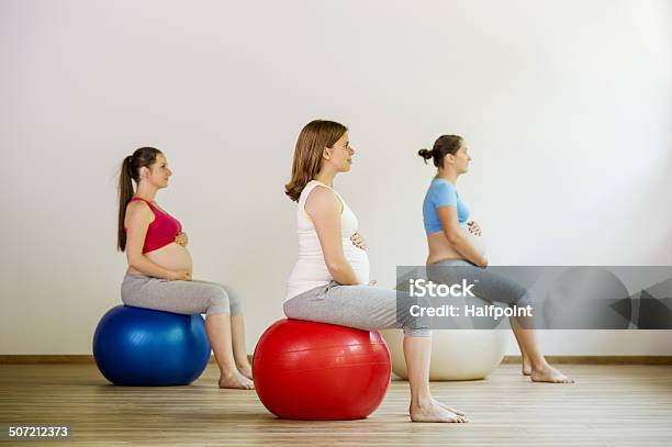 Pregnant Women Exercising Stock Photo - Download Image Now - Pilates, Pregnant, Abdomen