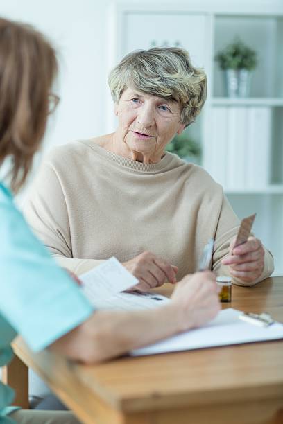 istock Elder woman with social worker 507212504