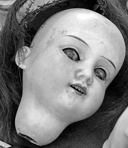 istock scary doll face in an antique shop 507212727