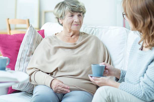 istock Senior lady with social worker 507212936