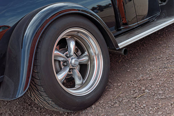 istock Back wheel of black vintage car 507213083