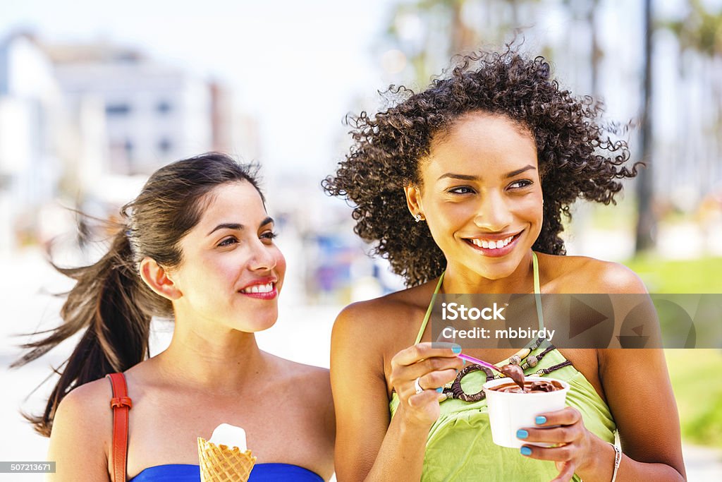 Young women with ice creams Young women walking with ice creams at Venice beach, LA, USA. Shallow DOF, focus on right woman. 20-29 Years Stock Photo