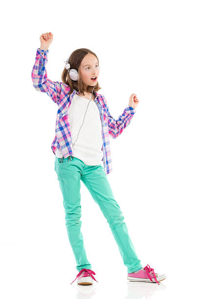istock Dancing girl with headphones 507213751