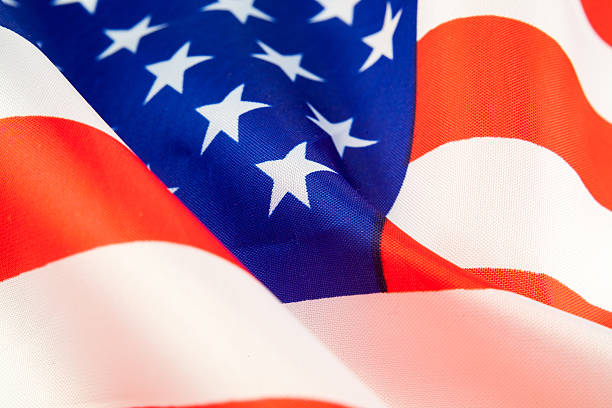 istock American dollars and flag 507214342