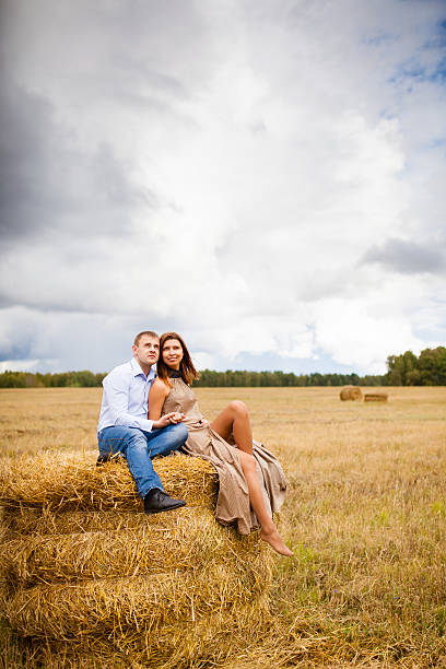 istock Couple in love young people resting on the haystack 507214434