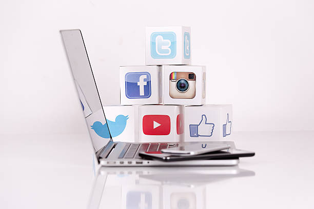 Social Media Cubes with Mobile Devices Sakarya, Turkey - December 30, 2015: Social Media Cubes on a White Background. Twitter, Youtube, Instagram and Facebook Like Logos on Paper Cubes with Macbook, Apple Smartwatch, Samsung Tablet PC and HTC Smartphone pinterest stock pictures, royalty-free photos & images