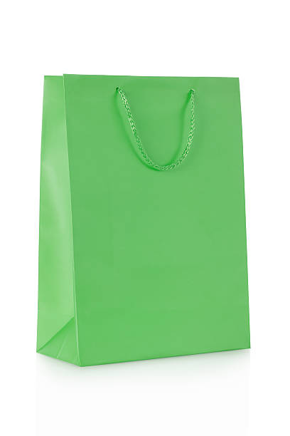 istock Green shopping bag in paper on white 507215964
