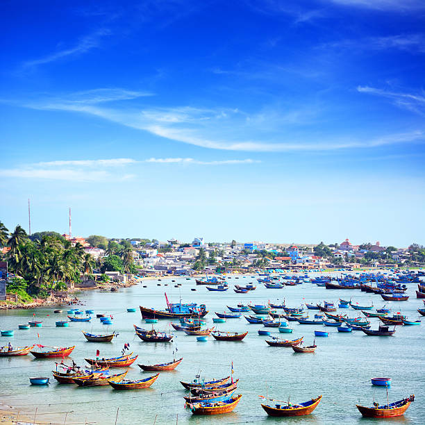 Fishing Boats, Vietnam Traditional vietnamese fishing boats in the harbor of Mui Ne. Composite photo mui ne bay photos stock pictures, royalty-free photos & images
