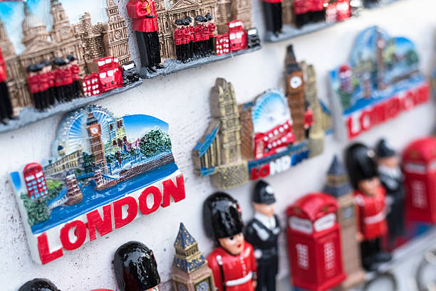 British Souvenirs LONDON, UK, JANUARY 23, 2016: Typical London street stall selling tourist souvenirs of classic British cuture on January 23, 2016. london memorabilia stock pictures, royalty-free photos & images