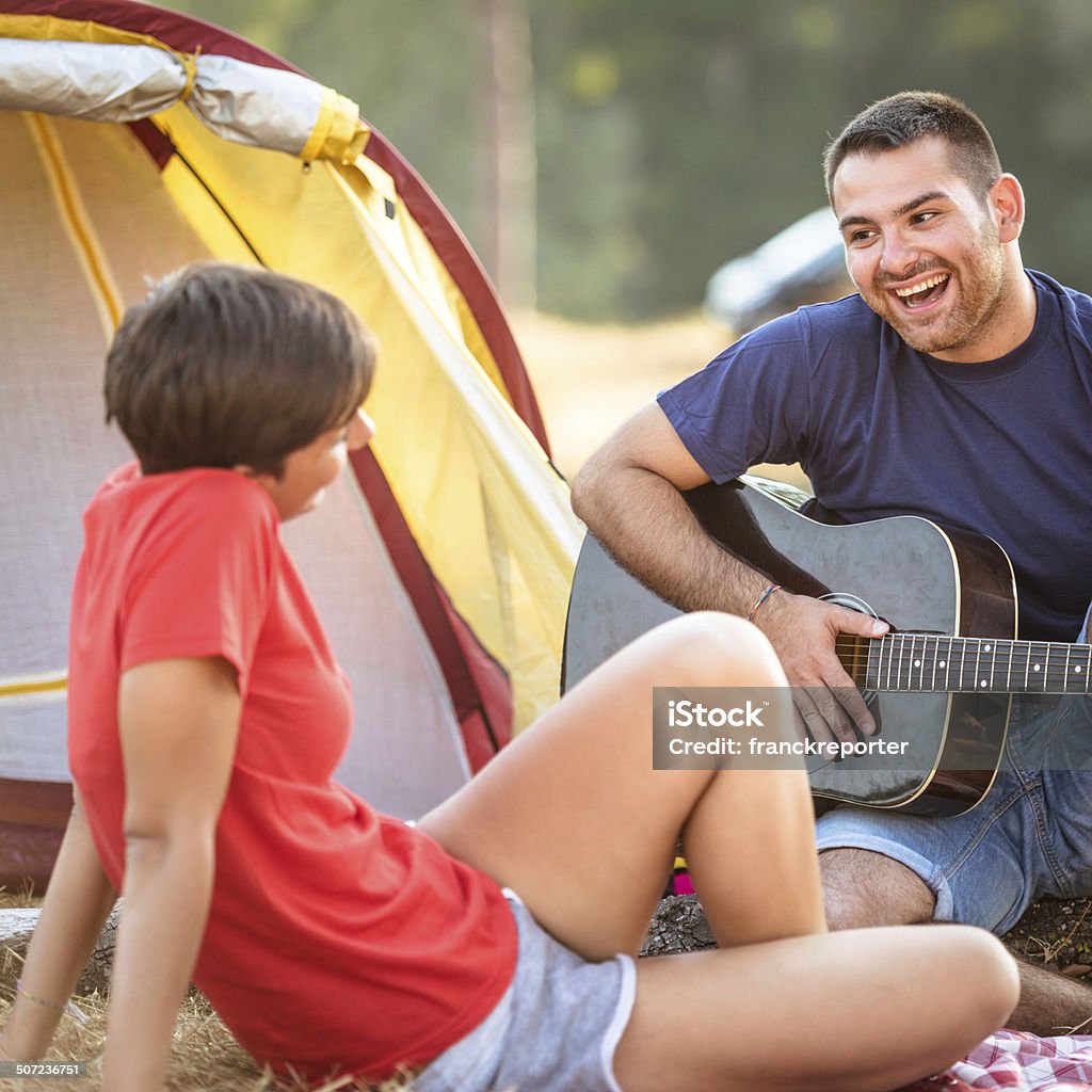 couple flirting at camping togetherness on summer http://blogtoscano.altervista.org/camping.jpg 20-29 Years Stock Photo