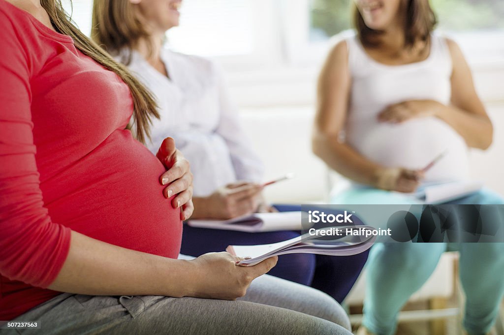Pregnant women at antenatal class Happy pregnant women meeting at antenatal class in the hospital Pregnant Stock Photo