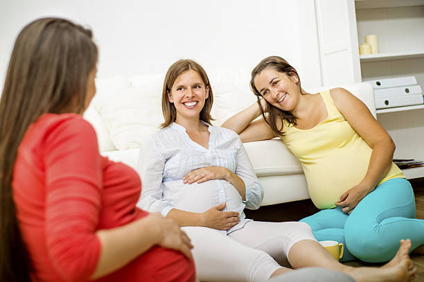 Pregnant females standing in row