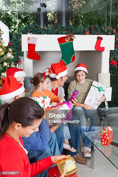 Family Open Gift Box Christmas Holiday Stock Photo - Download Image Now - Active Seniors, Adult, Boys