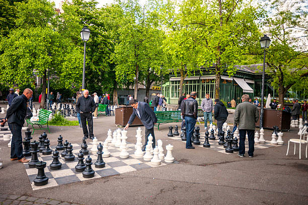 Geneva, Switzerland  - May 13, 2014: People playing chess in Geneva park