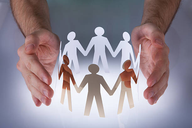 istock Hand With Paper People 507240417