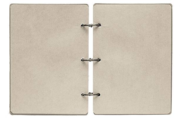 istock open notebook with pages of beige color 507240757
