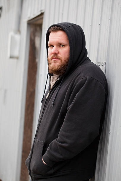 istock Homeless Man Alone Outside Looks sadly at camera 507242337